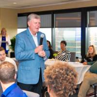 tom is given microphone to speak